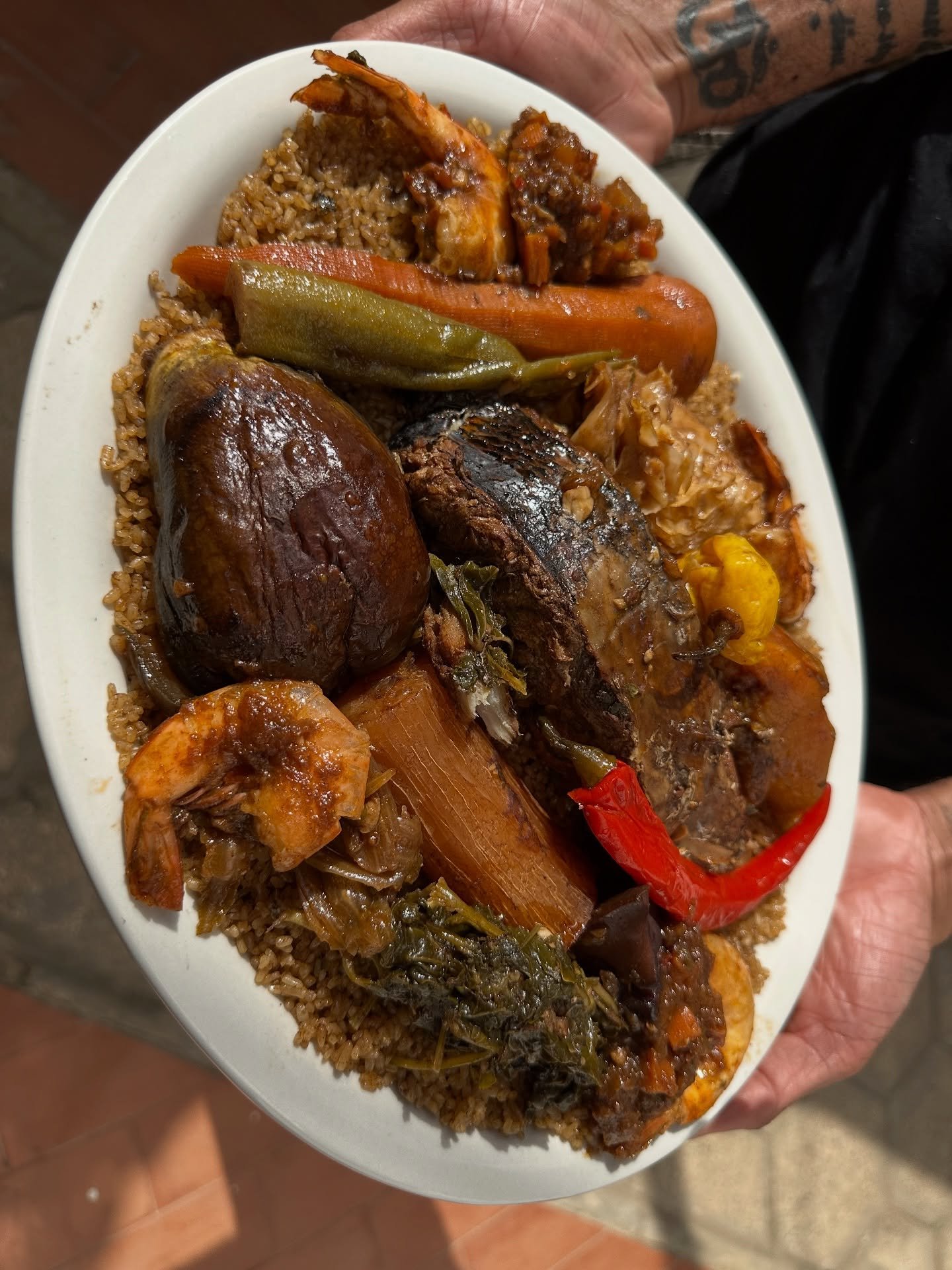 THIEBOUDIENNE | 🇸🇳 Na nga def?! For my bday in 2023, my brother (@muddalandant) &amp; I celebrated in Senegal! It was a trip full of culture, connection, flavor, sibling antics, and a few Wolof words! Learning to make Thieboudienne from the amazing