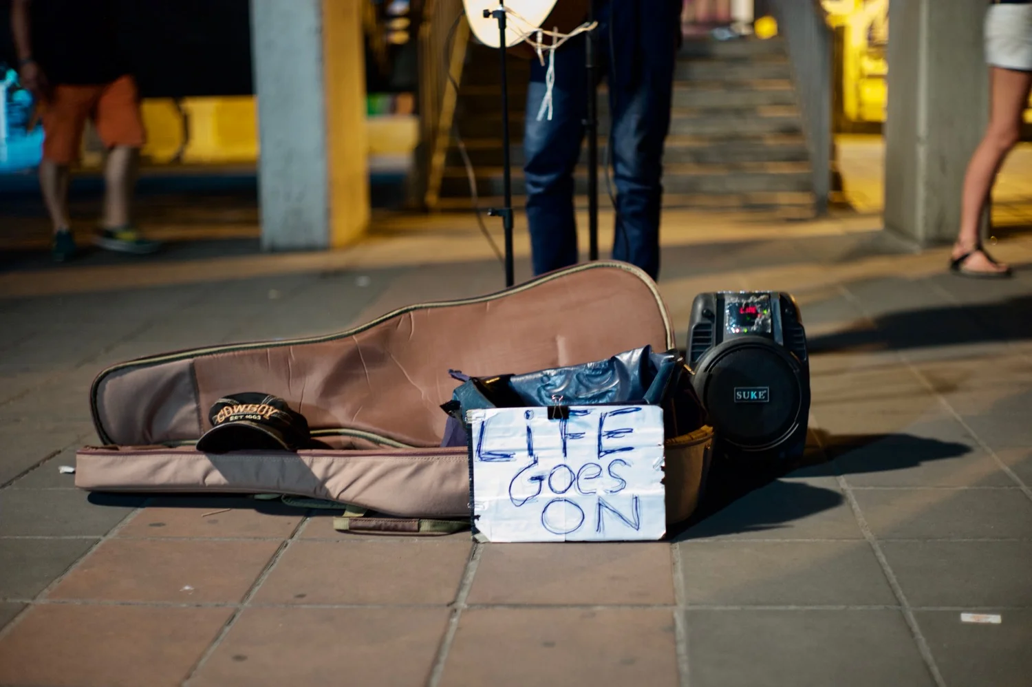 The guitar case of a busker who was almost always performing at the Saphan Taksin boat pier. 