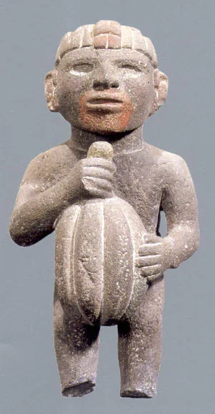 Aztec sculpture holding cacao pod. c. 14-15th Century. 