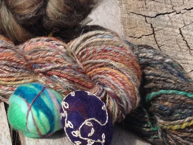 Hand-spun yarn and felted stones