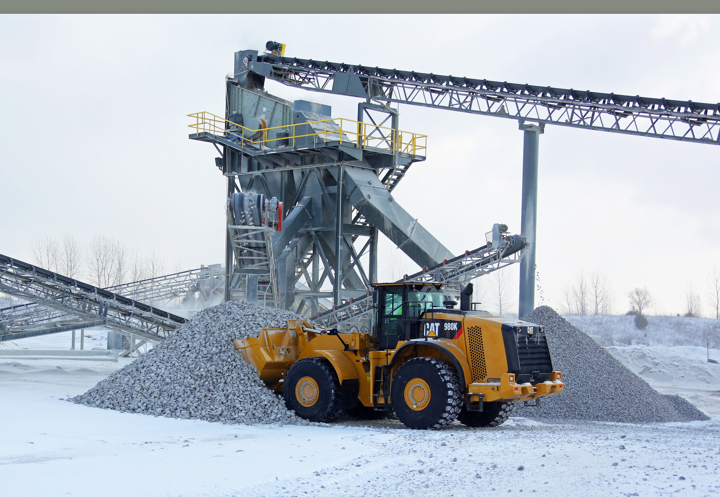 New Caterpillar 980K Stockpiling Rock - February 2015