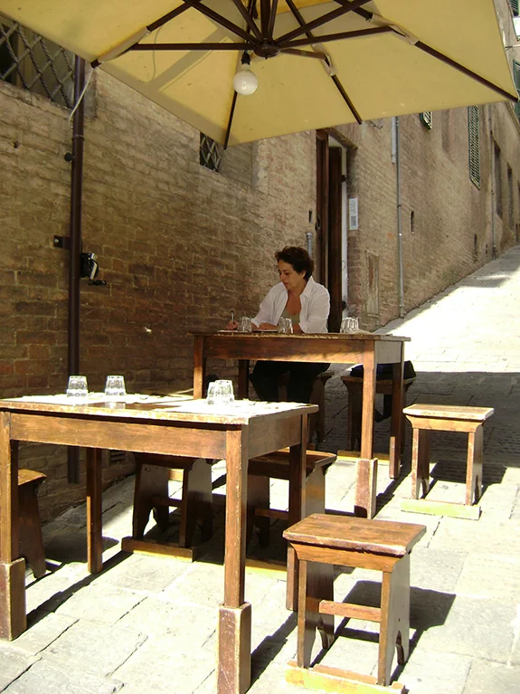 Writing at an outdoor cafe in Siena, Italy.