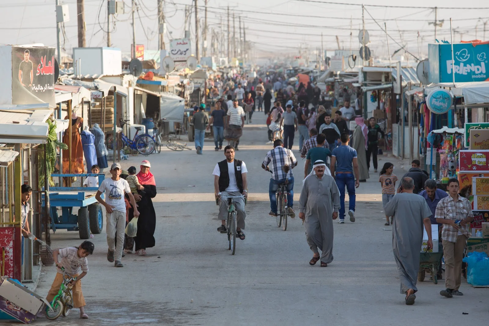 A bustling street in Zaatari refugee camp also referred to as the “Shams-Elysees”; All the stores are run by Syrian refugee entrepreneurs. Photo Credit: Jordi Matas/UNHCR