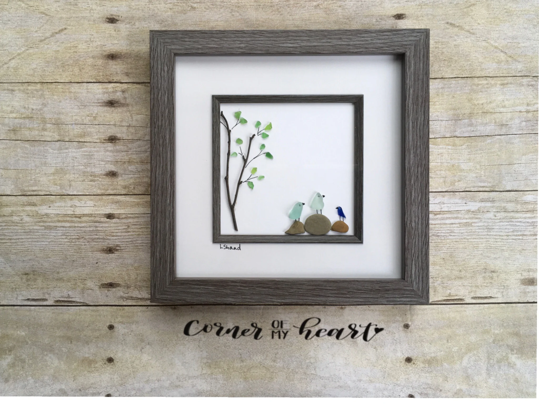 Three birds on rocks with tree