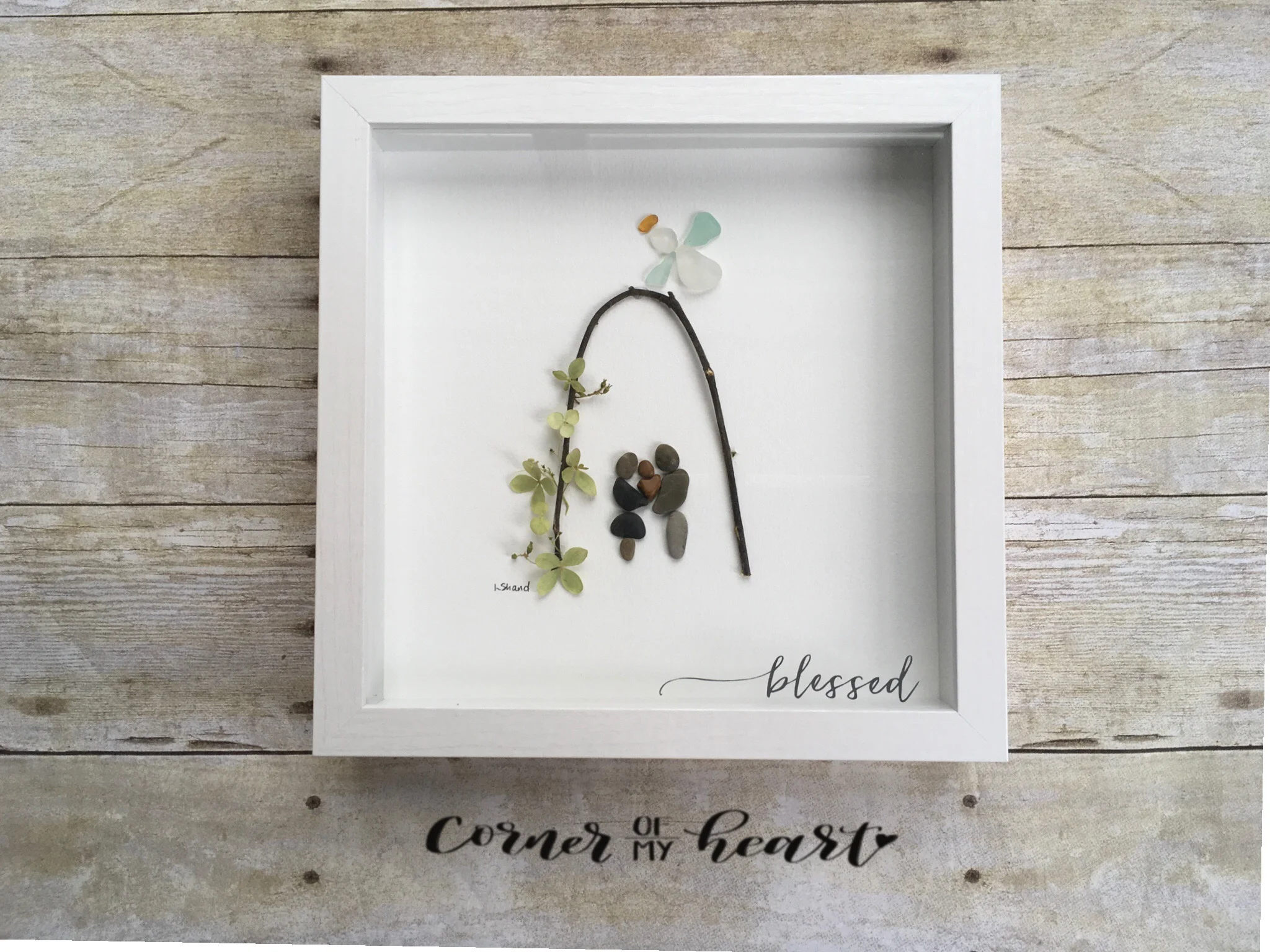 Couple holding baby with Angel watching over. "Blessed" overlay.