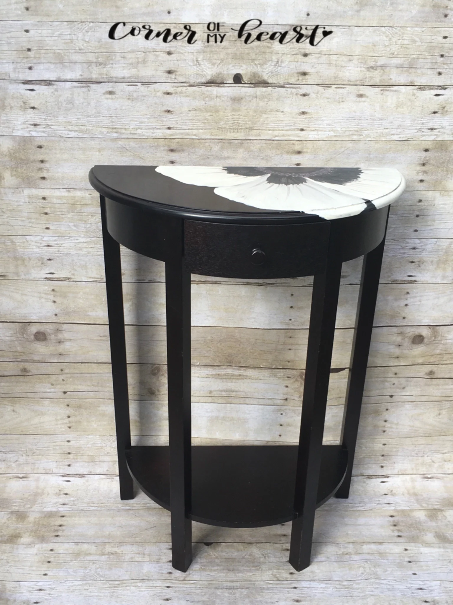 Entry table with large black and white flower