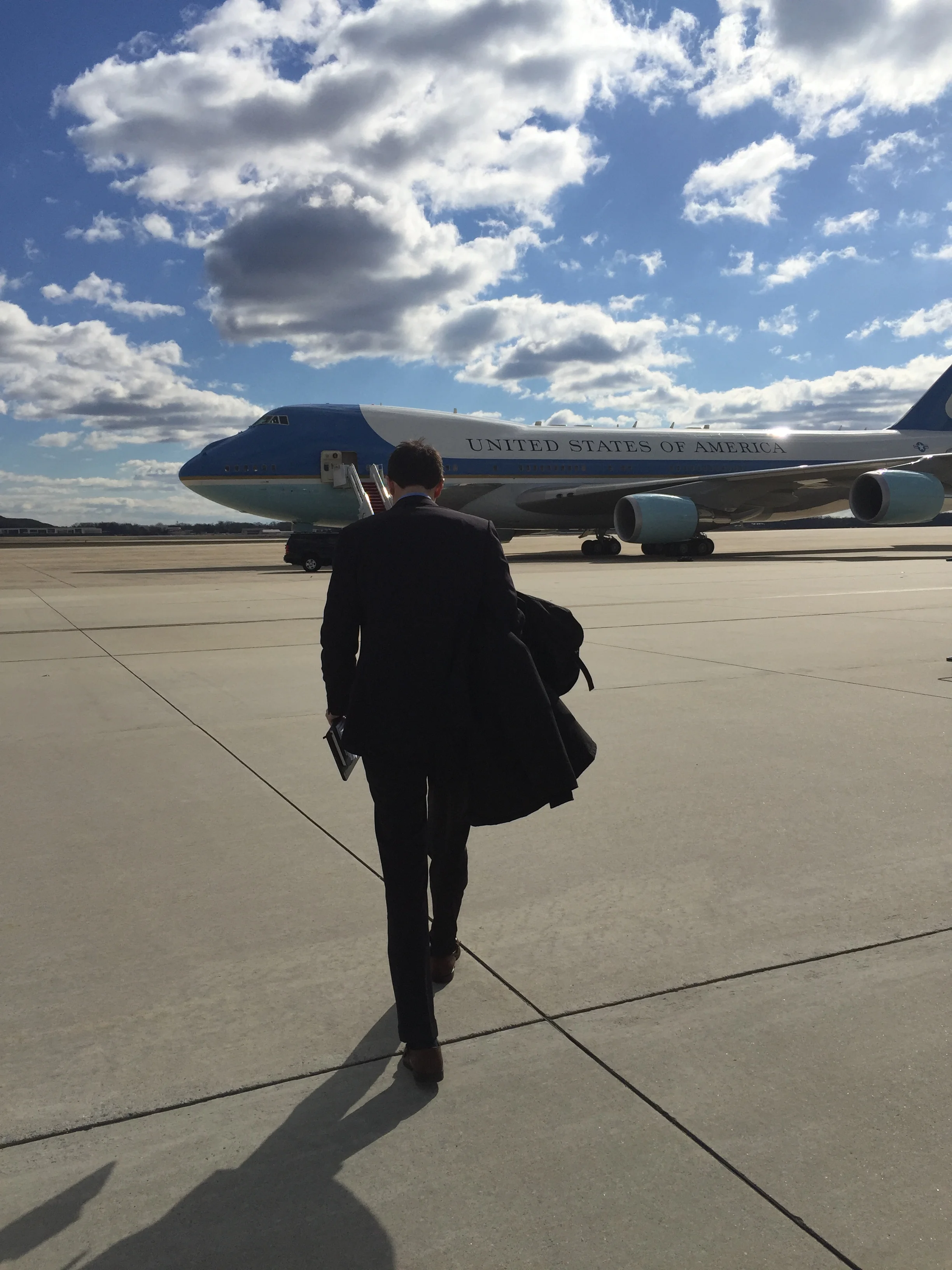 Andrew walking to Air Force One to interview President Obama in 2016.