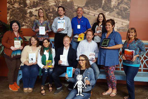 I’m holding with Lovely Traces of Hope (sitting far left) with Jeff Goins and other published authors in 2016