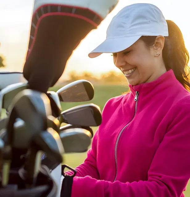 woman-ready-to-golf-with-club-in-hand.webp