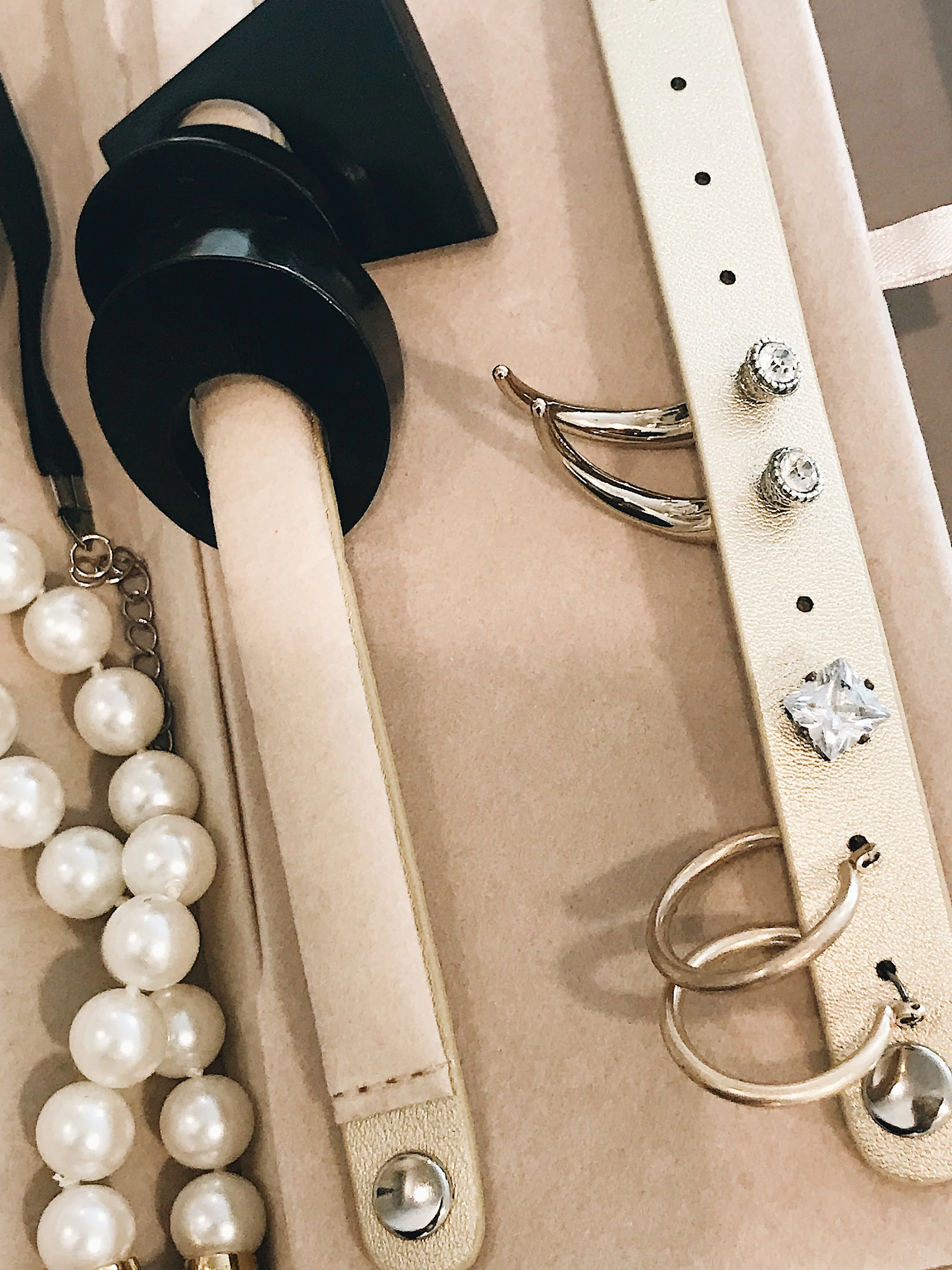 I love the ring holders and piercing strap, obviously for earrings...