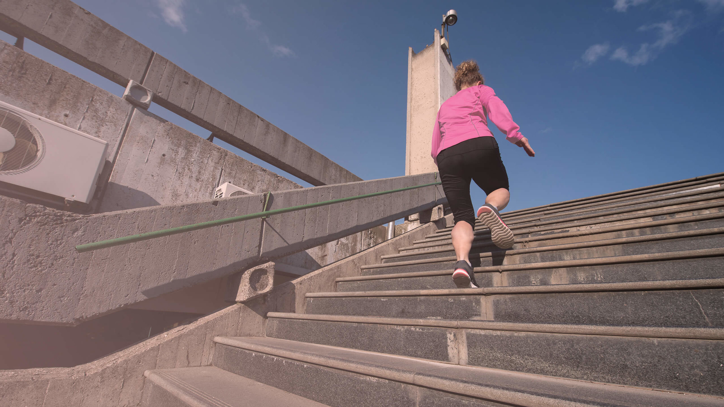 woman-jogging-on-steps-PZXBW6H (1).jpg