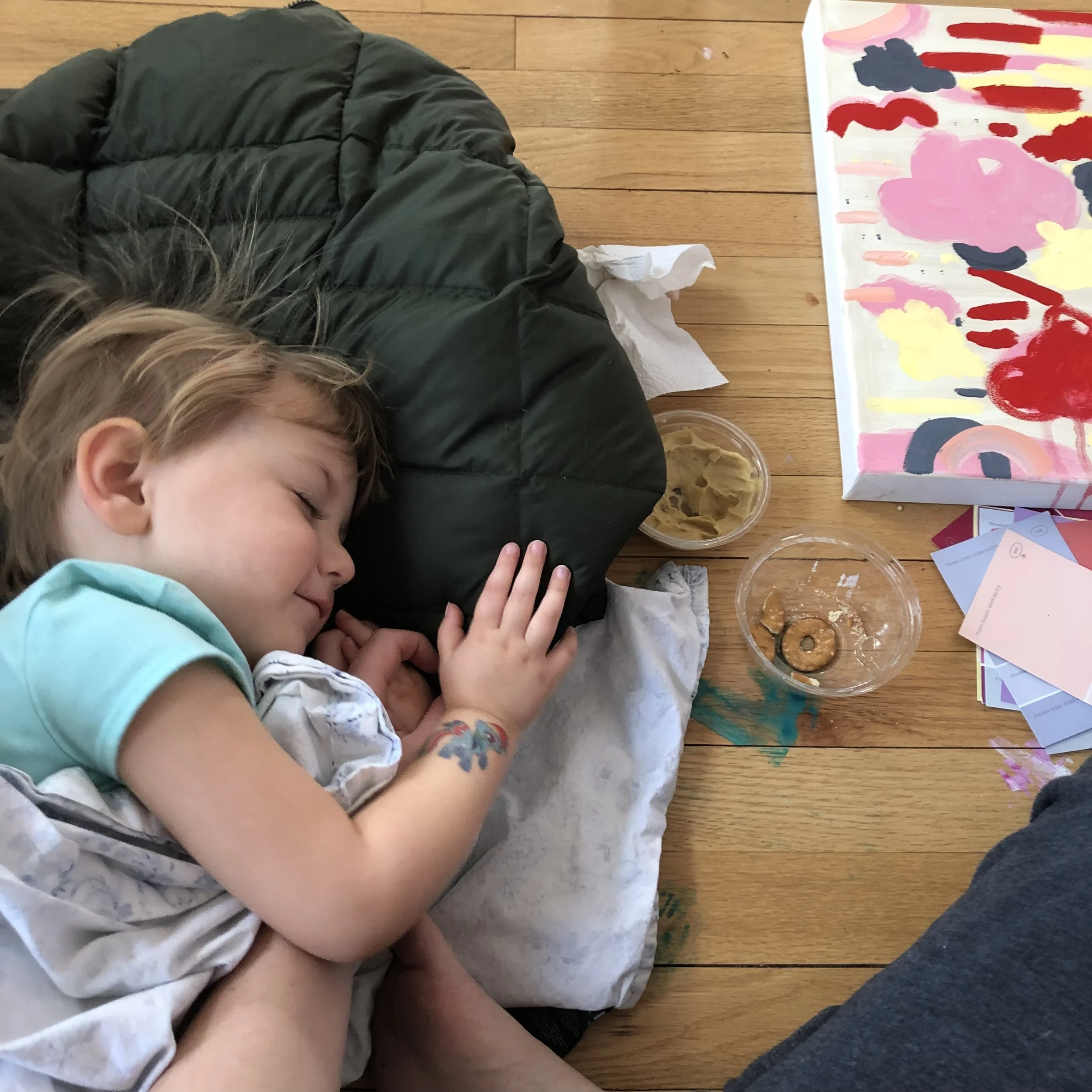 my Daughter, Cayce taking a nap in my studio while I paint
