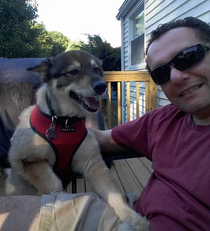 John C Research and Organization Liaison An animal lover his entire life, John became involved in animal welfare in 2006 when he adopted Enzo, a street dog originally from Puerto Rico. Learning about the horrendous fate of street dogs, known as “satos” on the American island territory, deeply impacted him. Interacting with local sato rescuers and rescue organizations, he was inspired to volunteer at a local animal shelter in MA that adopts out satos. John was honored and humbled to be asked to join the PAALs, Inc., Management Team, a unit consisting of such committed, passionate, and energetic animal welfare folks. In his current role, he serves as the principle point of contact with the many outstanding organizations that PAALs, Inc. supports through their grants. John’s professional history includes project management, operations, and HR roles in healthcare and publishing. He also has experience in communications and public relations. In addition to 15-year-old Enzo, John is DogDad to Tony, a 12-year-old Shepard mix rescued from South Carolina. John is a big Boston University hockey fan (the Terriers, of course!) and enjoys running, reading, and probably watches too much Nordic crime drama and classic TV on various streaming services.