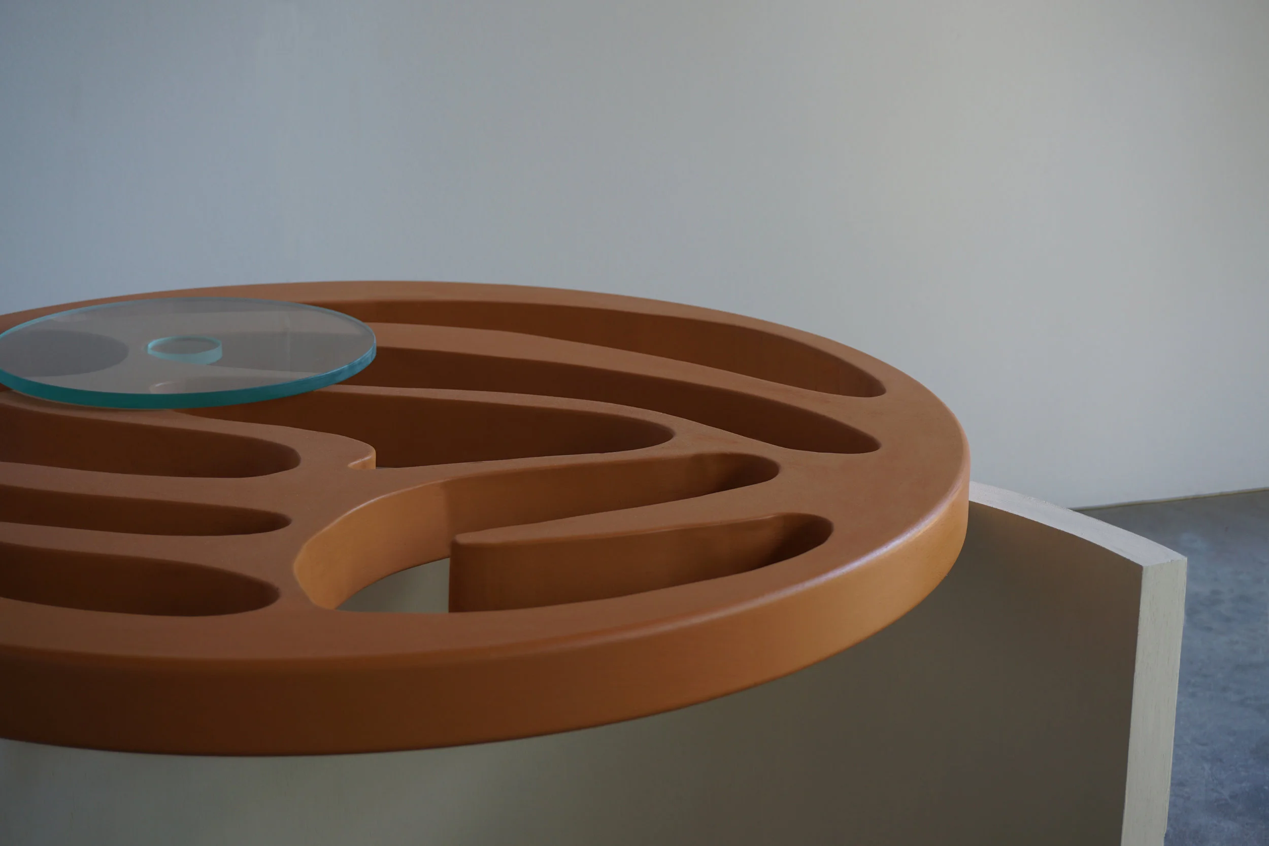 a nuanced table concept with biomorphic shapes and non-representational forms.