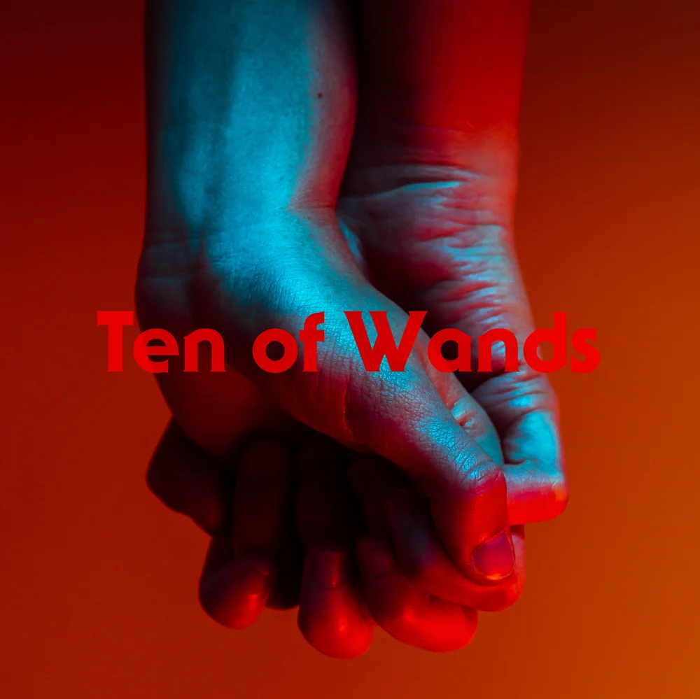 A close-up of two clasped hands lit in intense red and blue light. The muscles and tendons are tense, the fingers curled with effort — a visual metaphor for burden and endurance.