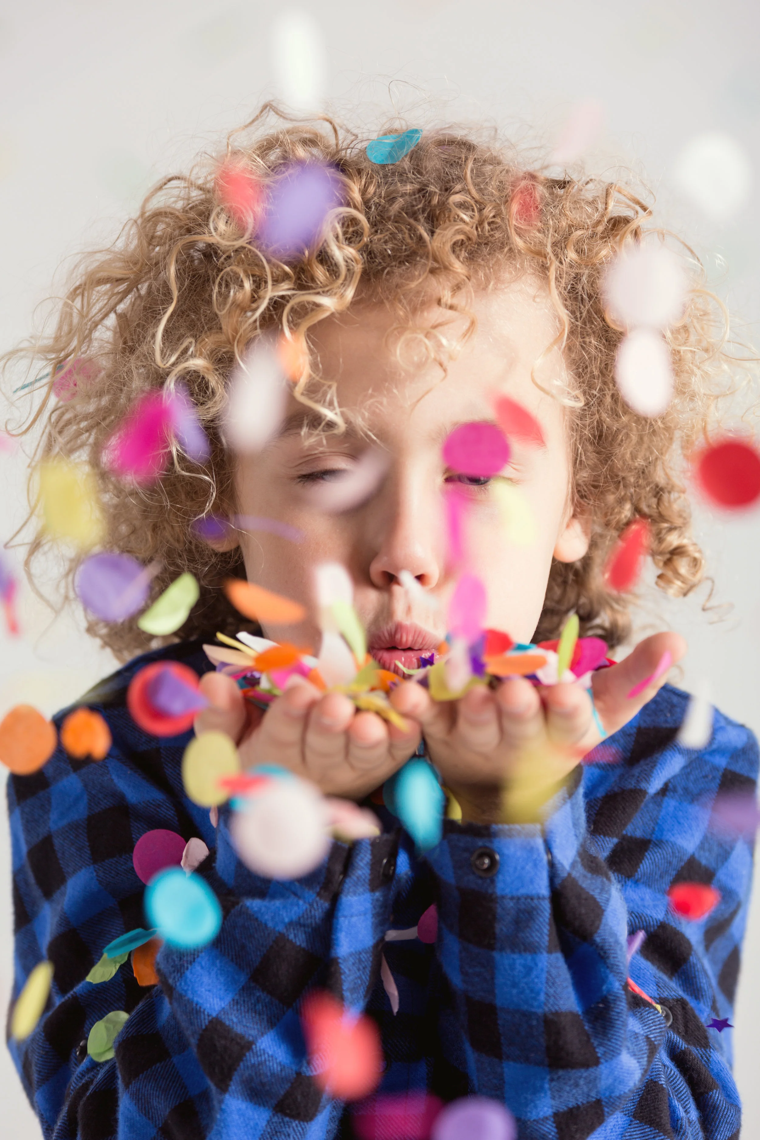 boy-blowing-confetti-P3M3EE7.jpg
