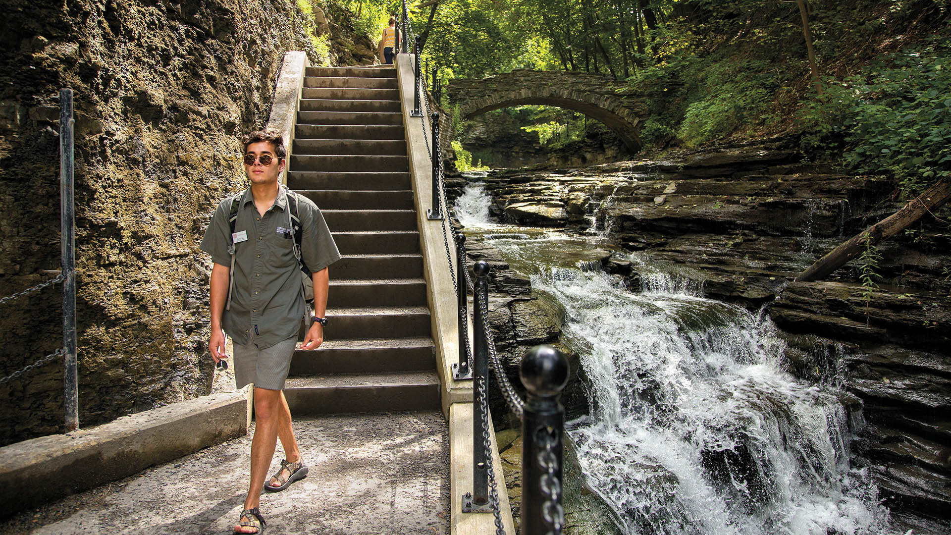 Student walking along Cascadilla Gorge