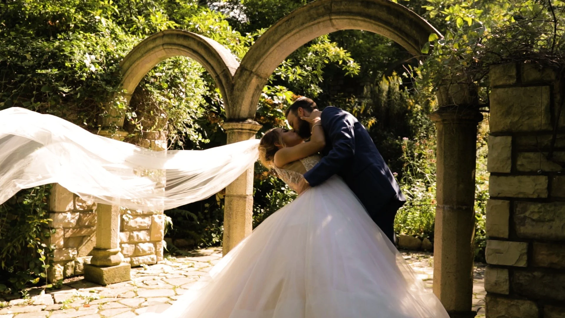 Cinematic wedding film still of a couple at the Cleveland Botanical Garden, featuring documentary-style videography by Blue Home Productions.