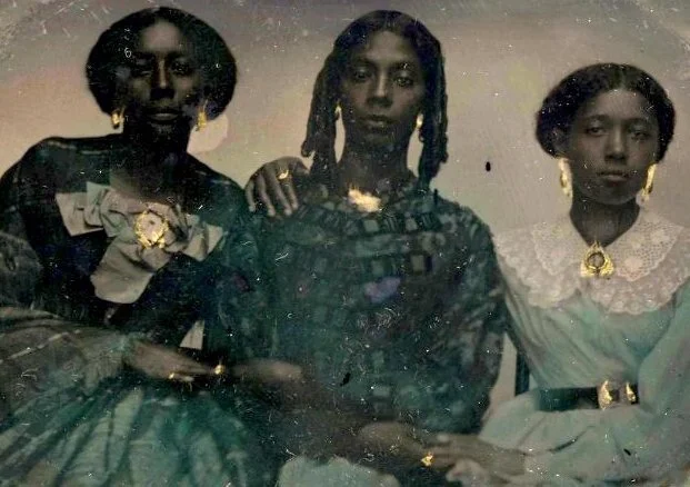  Hand-colored tintype portrait of three unidentified African American women, c. 1865. Source: Harvard Library 
