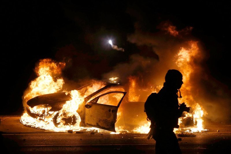 a police car in flames.