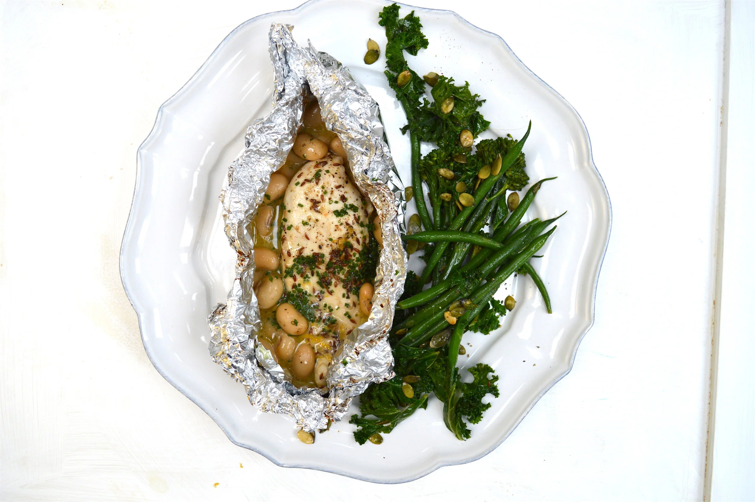 poached-coconut-chicken-parcels-with-green.jpg