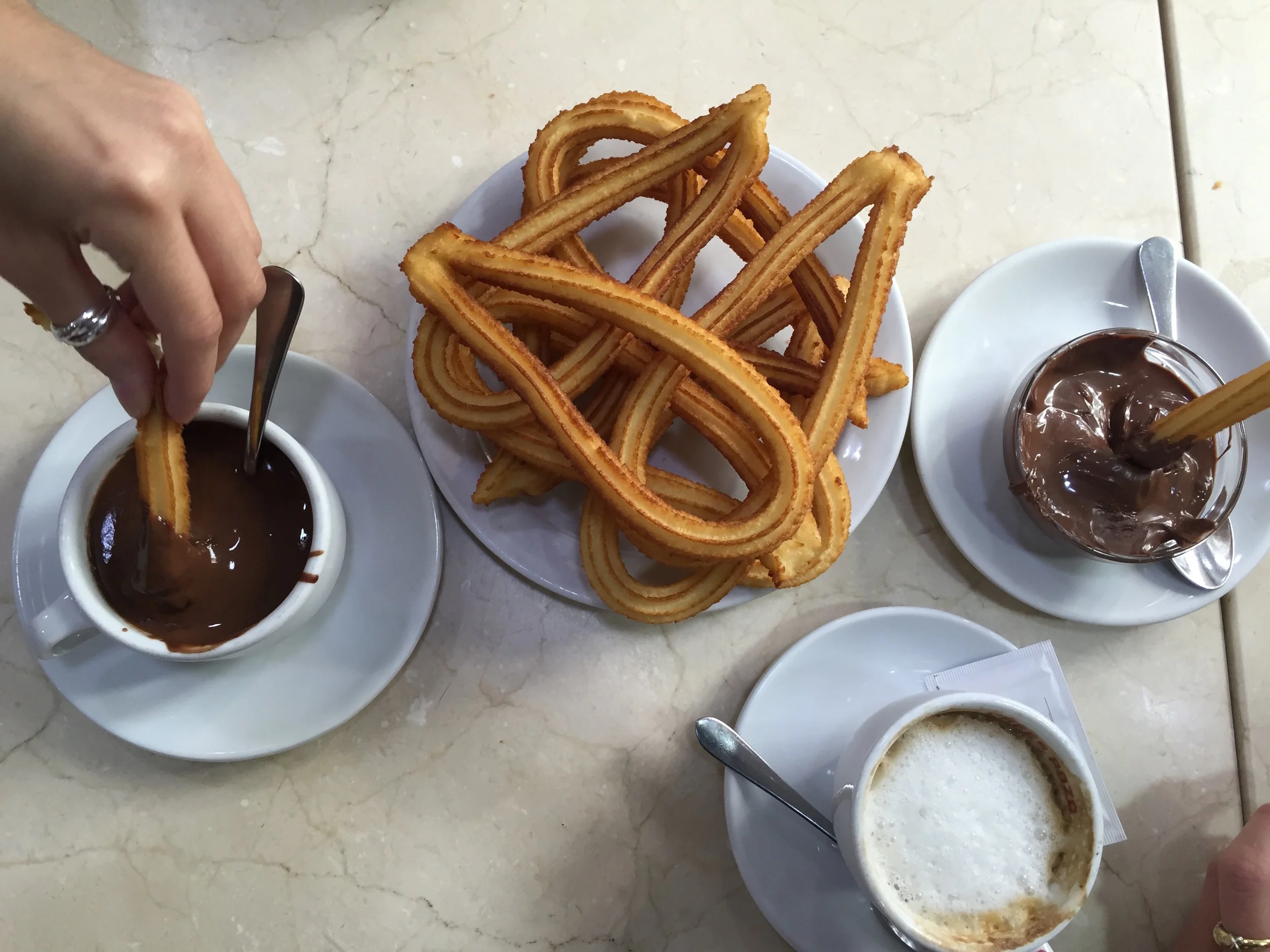 Los Artesanos 1902 Churros that first opened in 1902 and it's still going. This is a classic Spanish joint with stark lighting and cool marble interiors. The waiters wear traditional uniform and you can watch the churros being made in the old-school-style fryers. I went for the simple churros with dark chocolate sauce with my morning coffee. Calle Artesanos, 1902, 28660 Boadilla del Monte, Madrid, Spain http://www.losartesanos1902.com