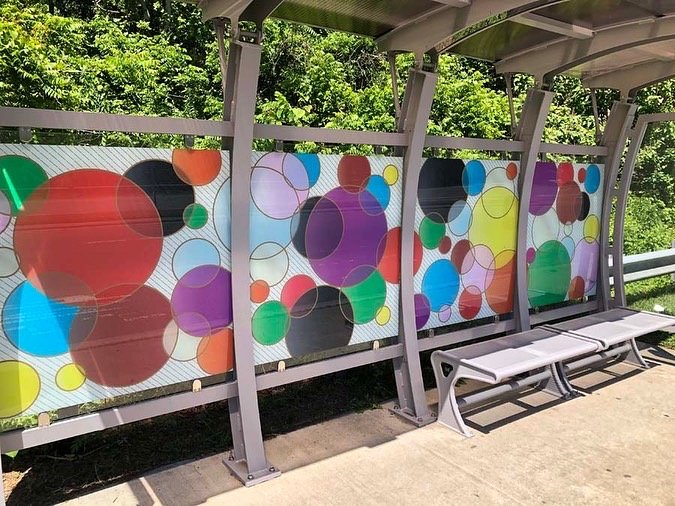  “We Knew The Path Forward Was Intersectional” is a digital illustration printed on vinyl for a Chapel Hill, NC transit shelter by North Carolina public artist, Jane Cheek. Based on the progressive pride flag and meant as a signal of inclusivity.  