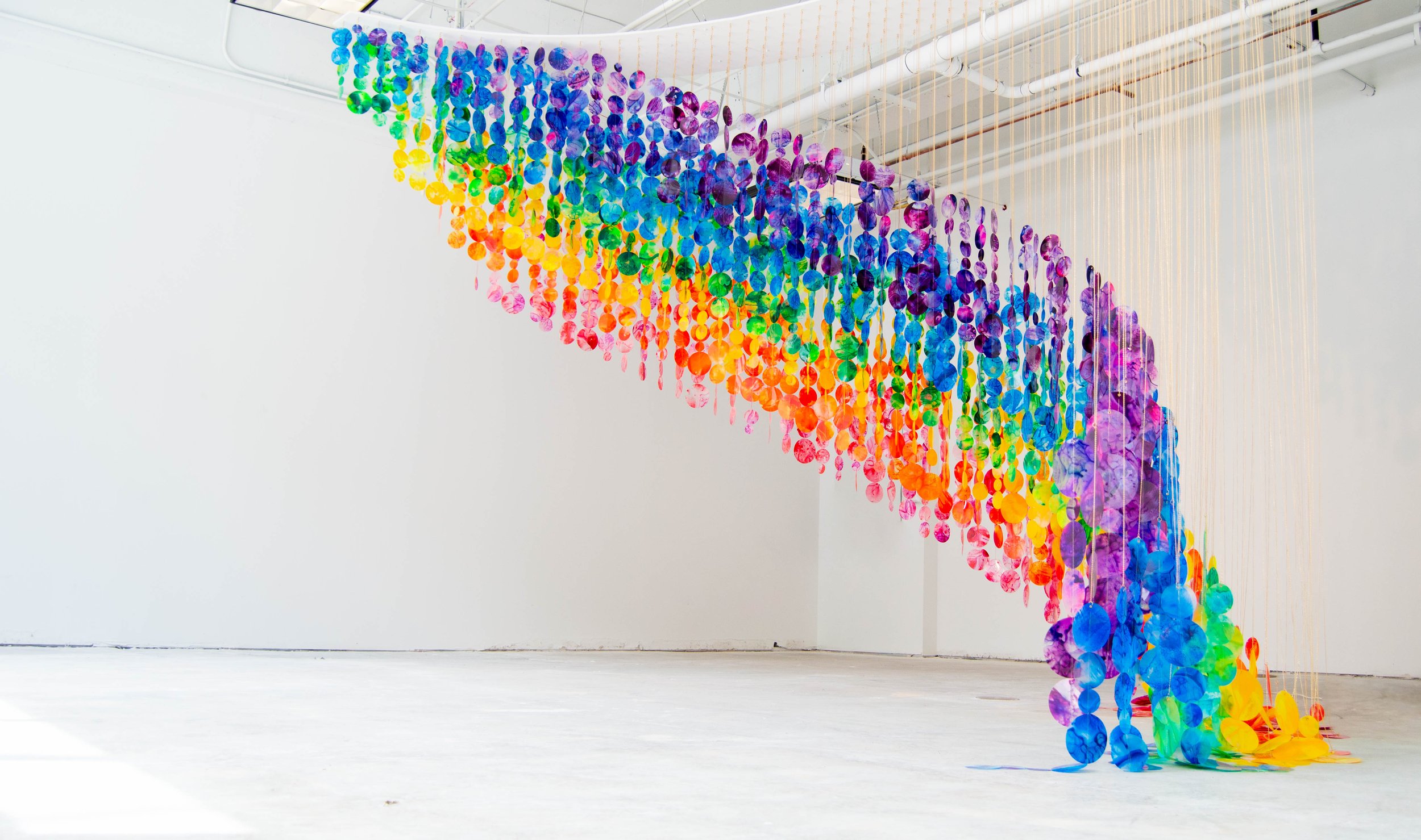   Suspended rainbow installation, giant immersive mobile art, Raleigh North Carolina installation artist, colorful kinetic rainbow sculpture, immersive installation, suspended sculpture, Raleigh North Carolina sculptor We Wondered If We Could Reach I