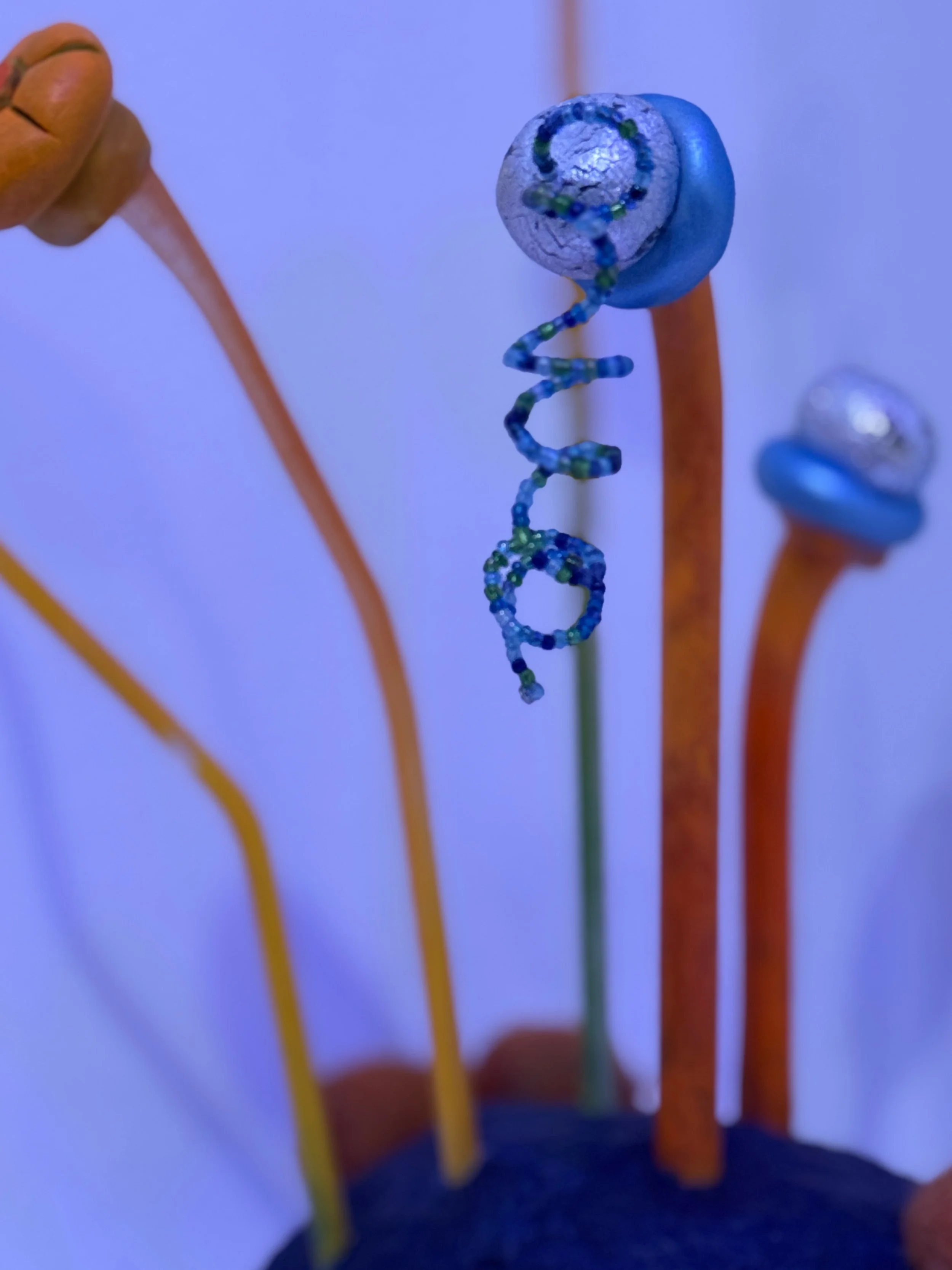 small sculpture, abstract plant art, lichen sculpture, flower sculpture, cobalt blue and orange sculpture, reclaimed materials, whimsical art