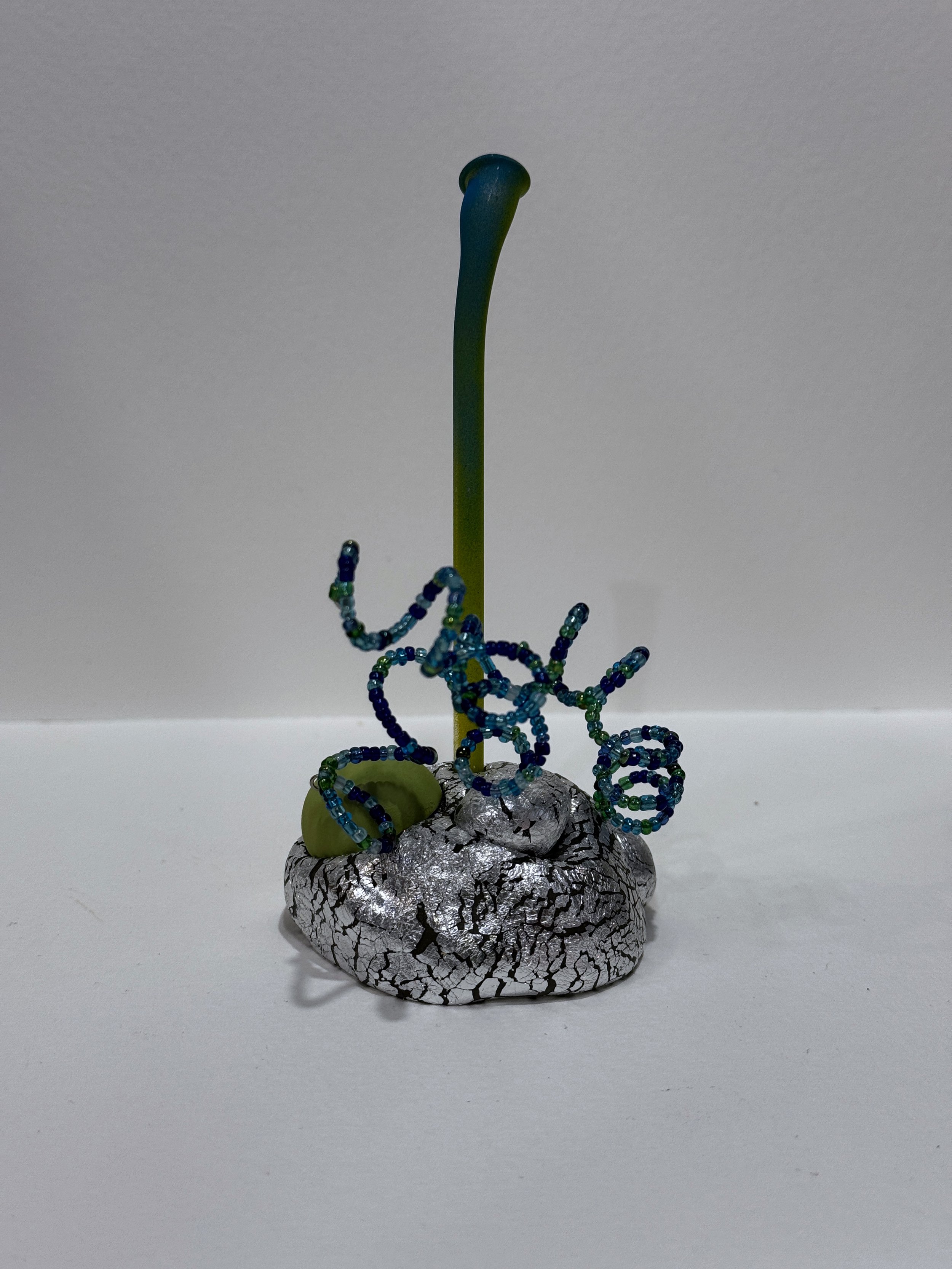 free standing sculpture, table top sculpture, bookshelf art, abstract plant sculpture, colorful whimsical art, alien plant sculpture, reclaimed materials, surreal art