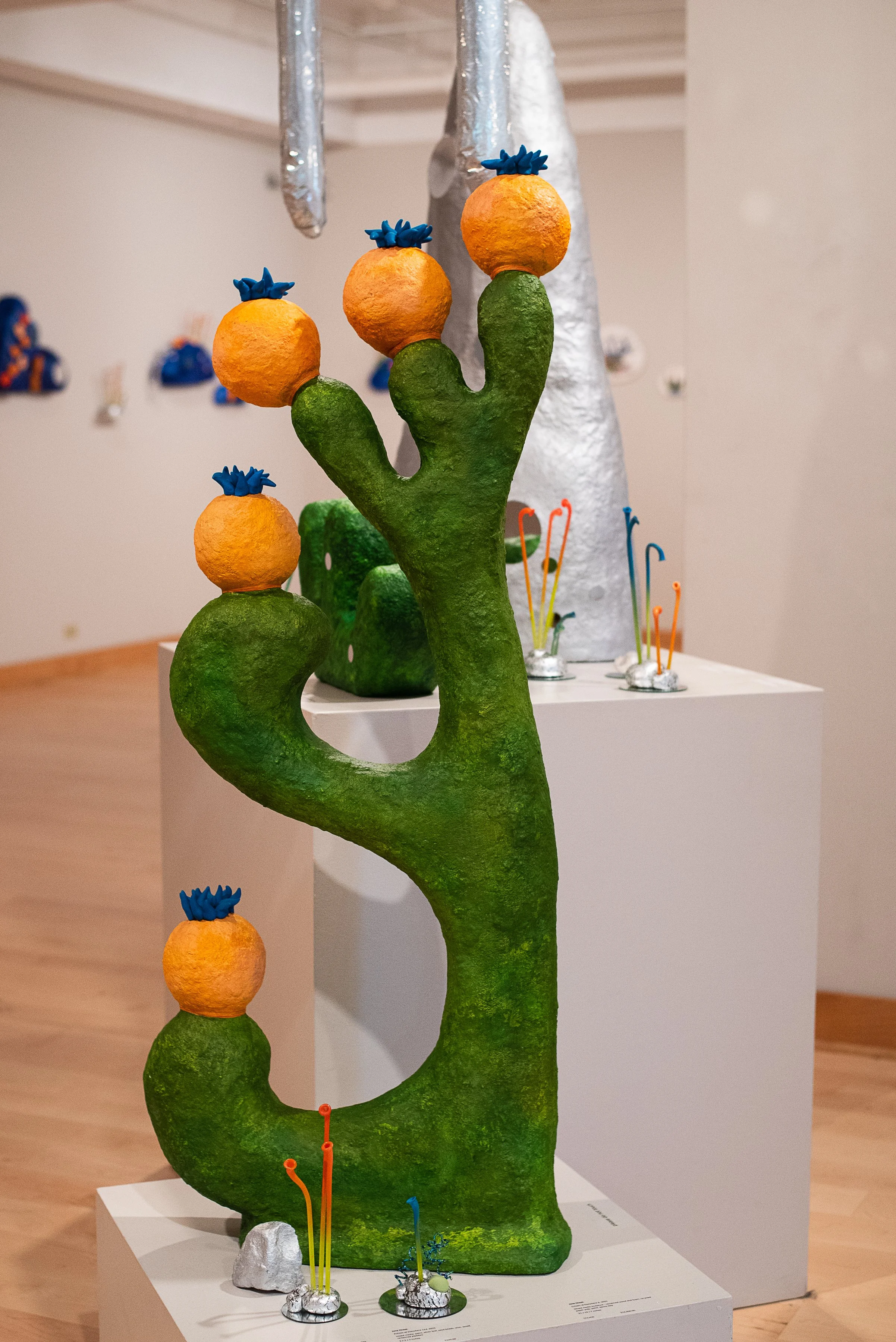 create an abstract sculpture made of reclaimed materials in adult art class, after work art club