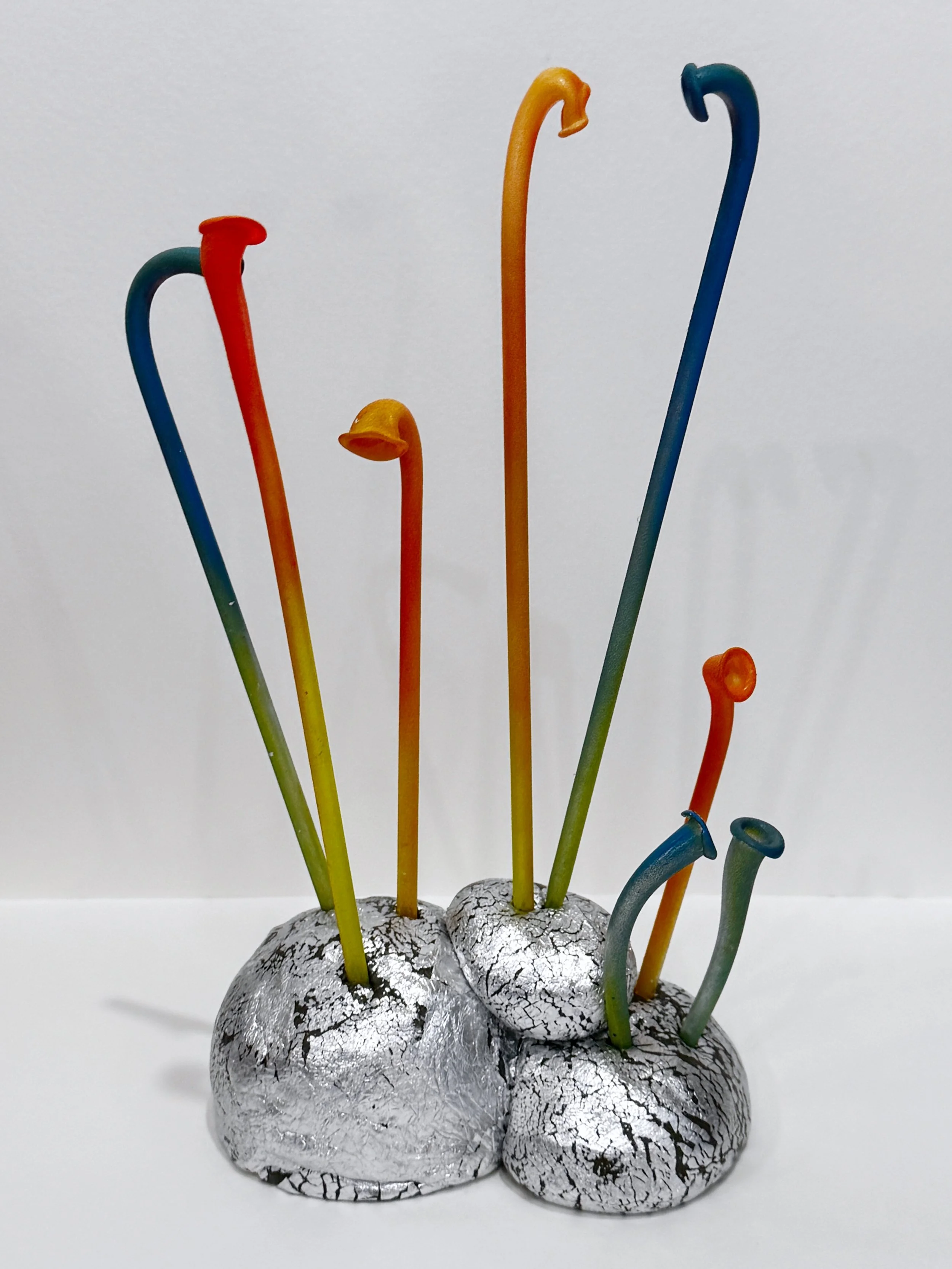 free standing sculpture, table top sculpture, bookshelf art, abstract plant sculpture, colorful whimsical art, alien plant sculpture, reclaimed materials, surreal art