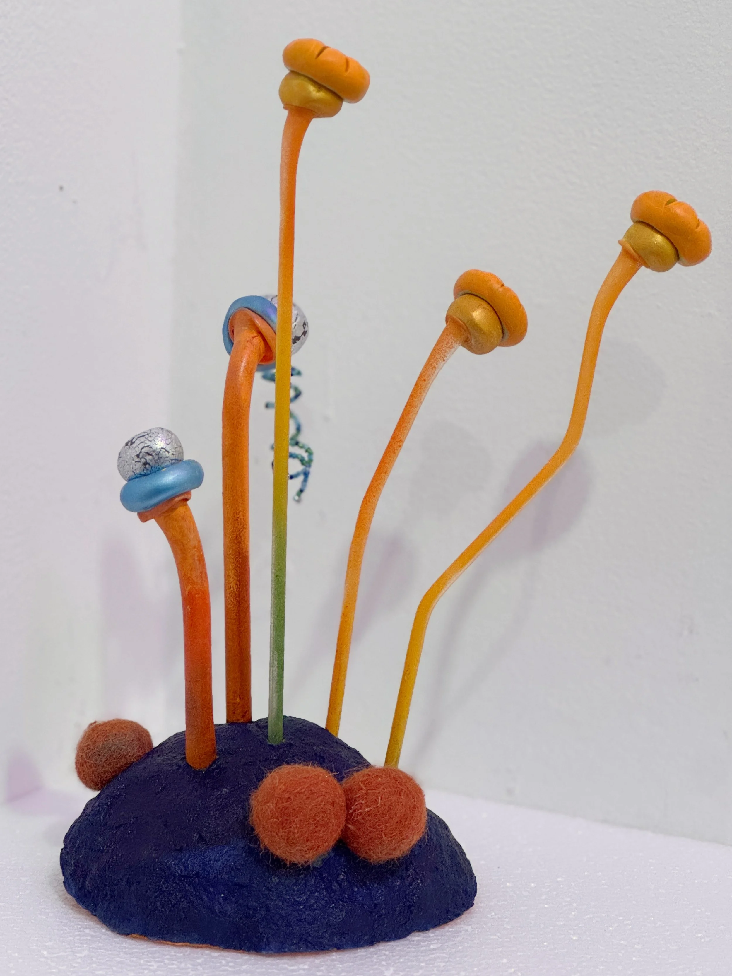 small sculpture, abstract plant art, lichen sculpture, flower sculpture, cobalt blue and orange sculpture, reclaimed materials, whimsical art