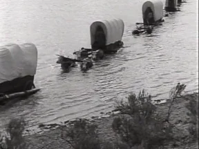 Wagons crossing river.jpg