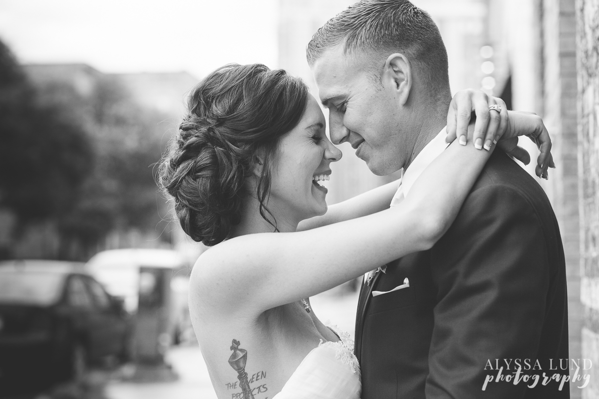 Laughing wedding portrait outside Aria Minneapolis