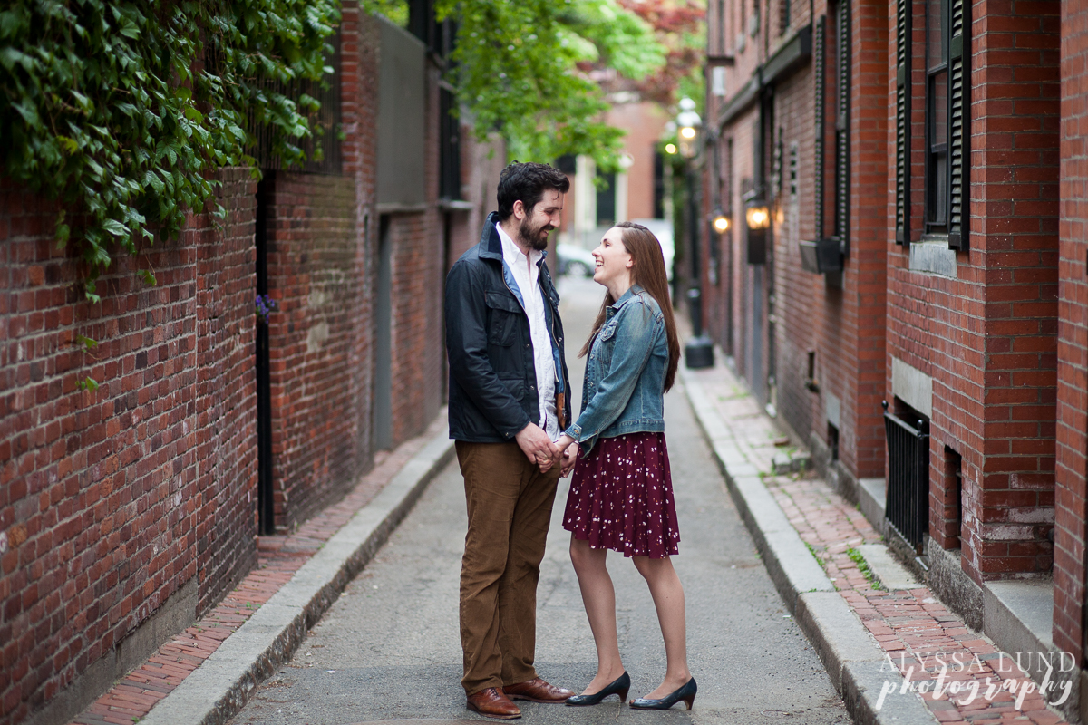 Relaxed engagement portrait in an alley