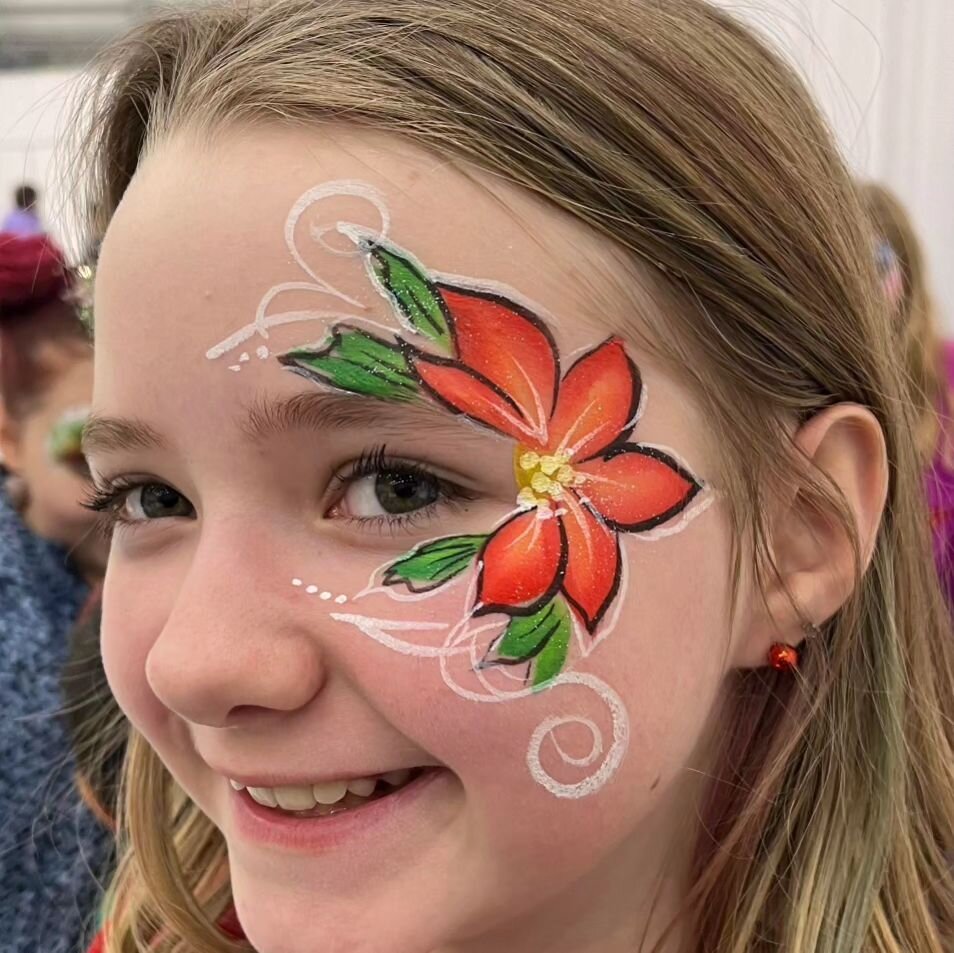 Alaska Airlines Holiday Party face paint by Tatiana #facepaintalaska #wasillafacepainter #wasillaalaska #anchoragefacepainter #facepaint #colormefunalaska #alaskafacepainting #alaskapartyservices #otjfacepainting  #christmasfacepaint #poinsettiafacep