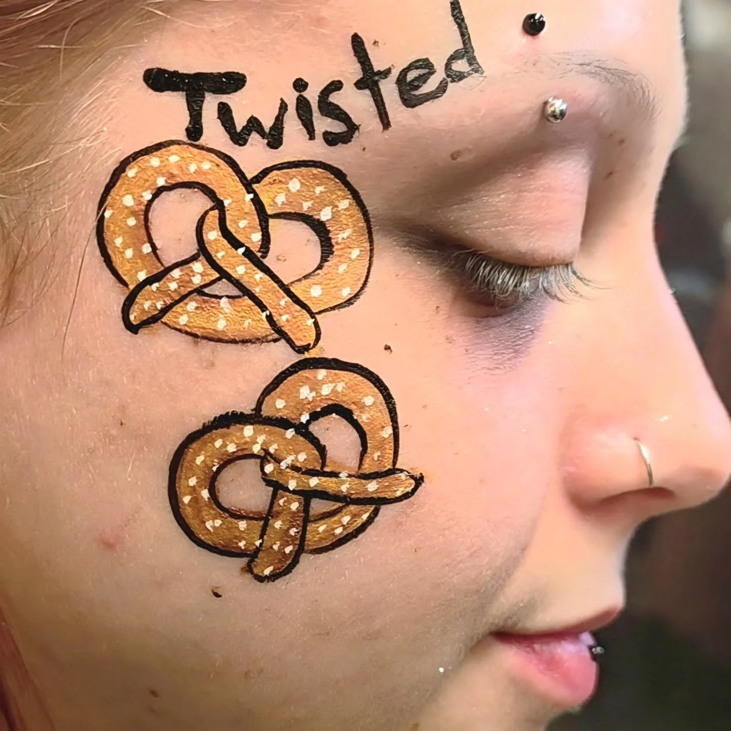 One of the many employees that got painted from the Twisted Pretzel Booth at the Alaska State Fair!