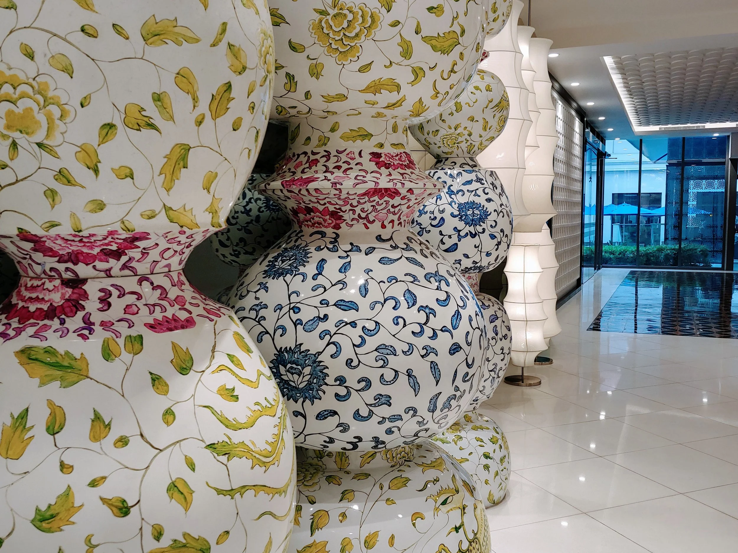 Stacks of the ceramic pots in front of the lifts, what an extraordinary art piece!