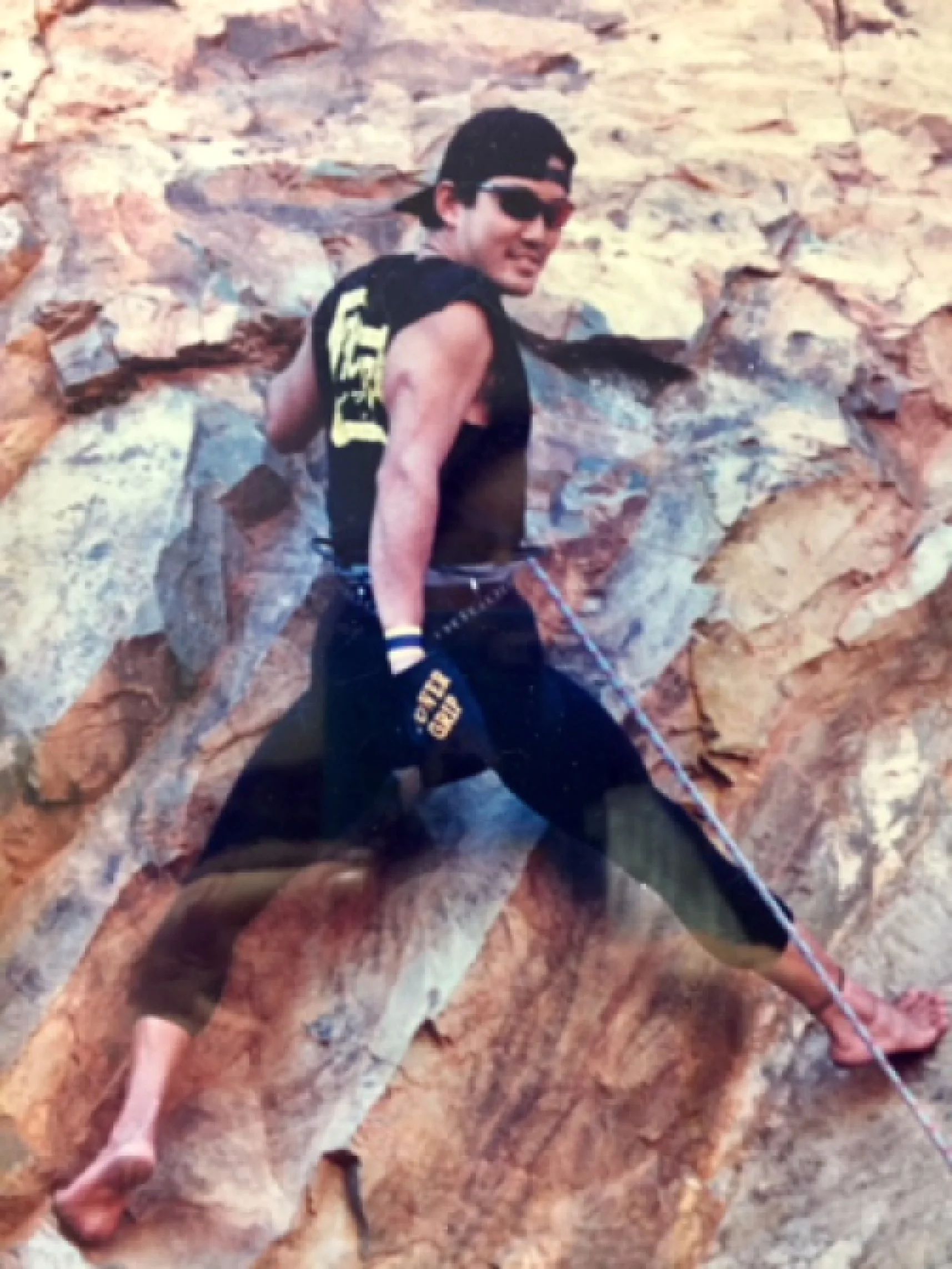 Dr. Benjamin Saito's post-operative patient scales a rock wall near Bowdoin College.