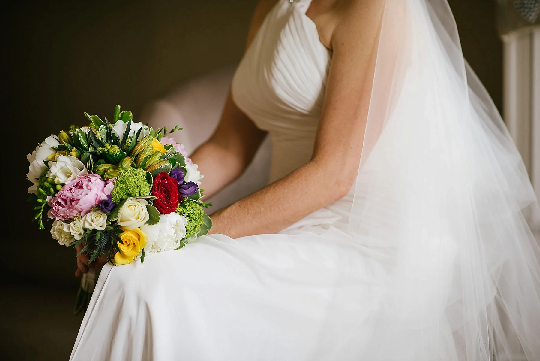 close up of the wedding flowers and dress