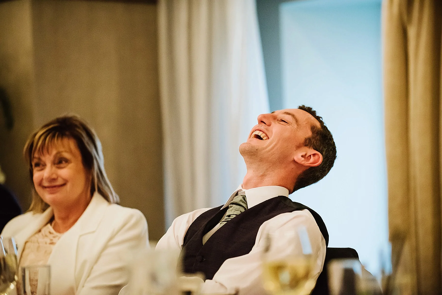 groom-laughing at best man's speech