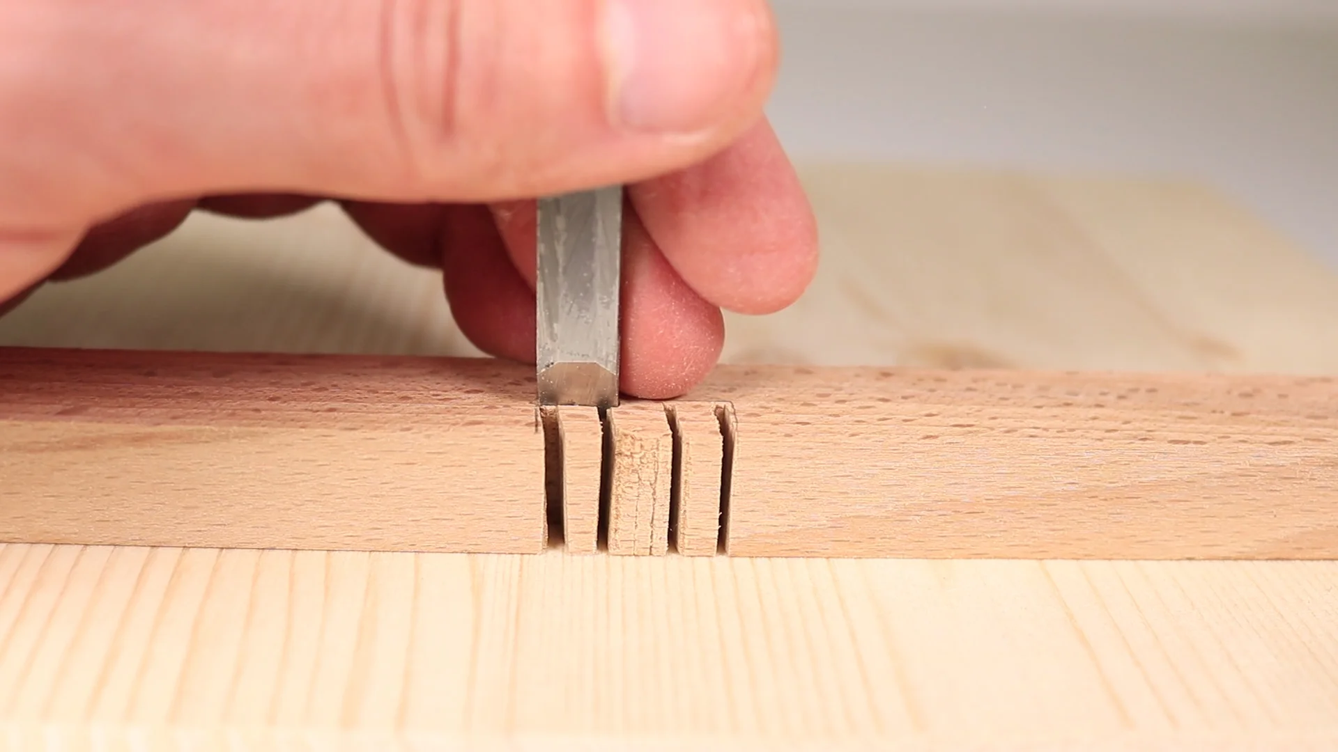 Now chop the wood using the chisel.