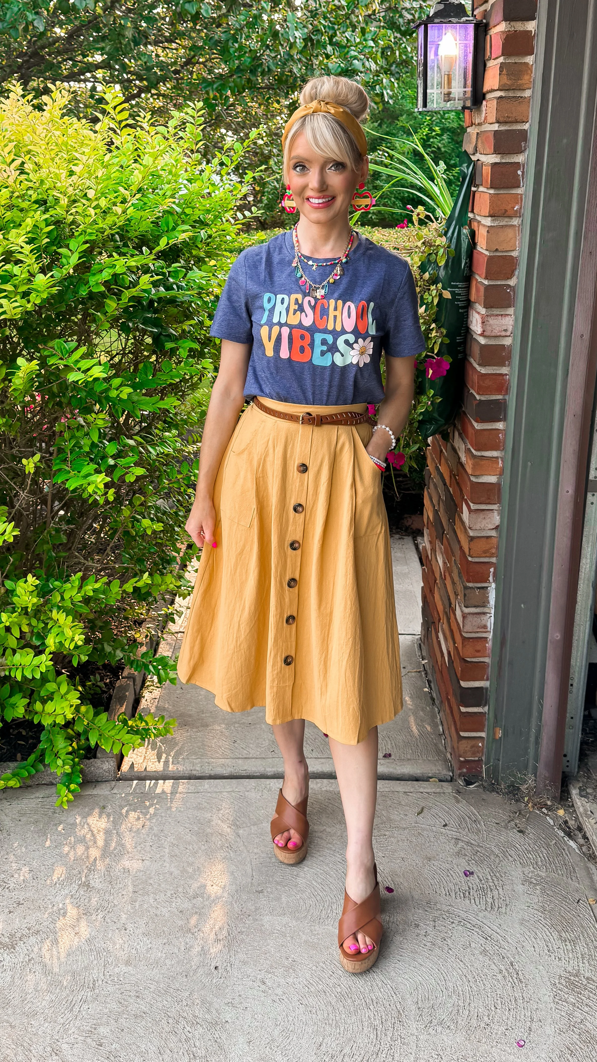  Blonde preschool teacher wearing a preschool vibes tshirt and appropriate skirt from amazon 