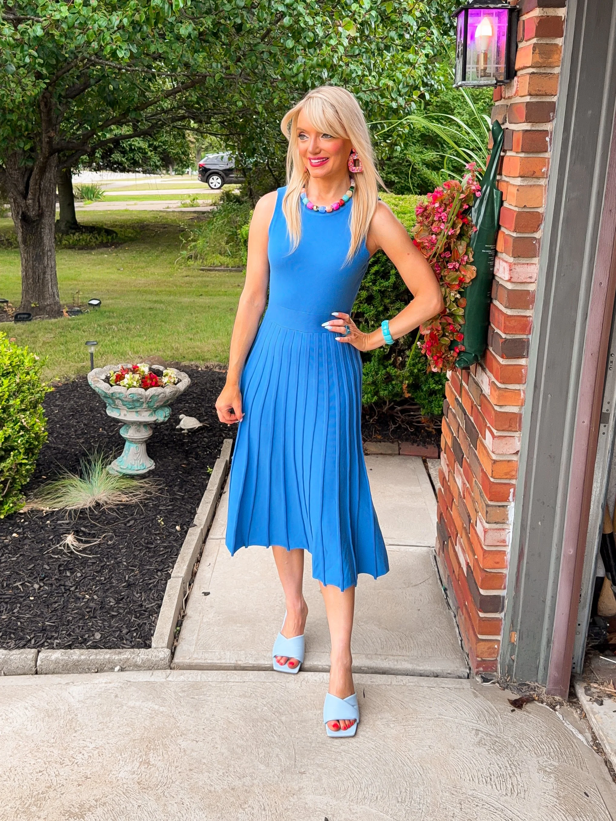  blonde woman wearing professional work wear business casual knit sleeveless dress for late summer into early fall transition from amazon  