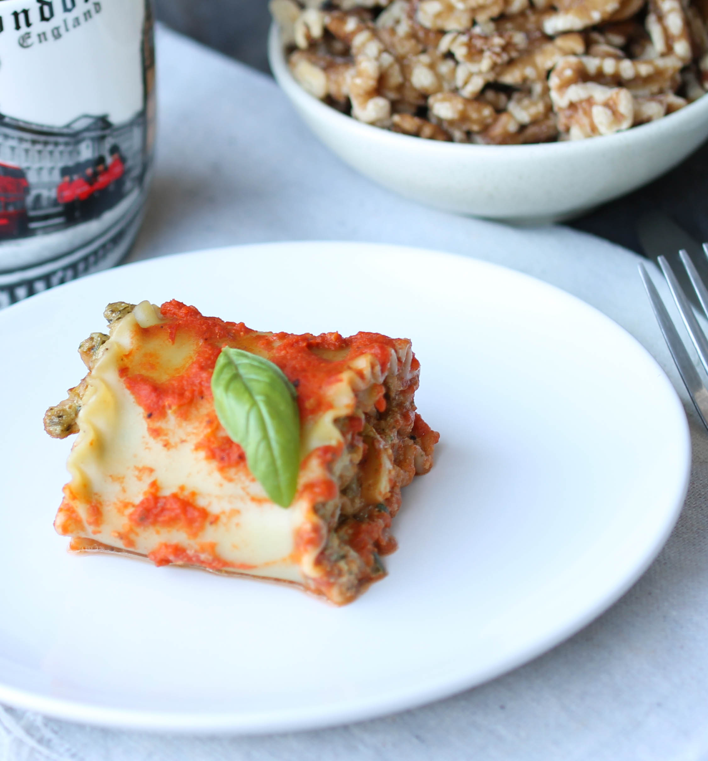 Vegan Lasagna Roll-Ups with Walnut Basil Sauce is dinner friendly, can be make-ahead, and comes together in within an hour.