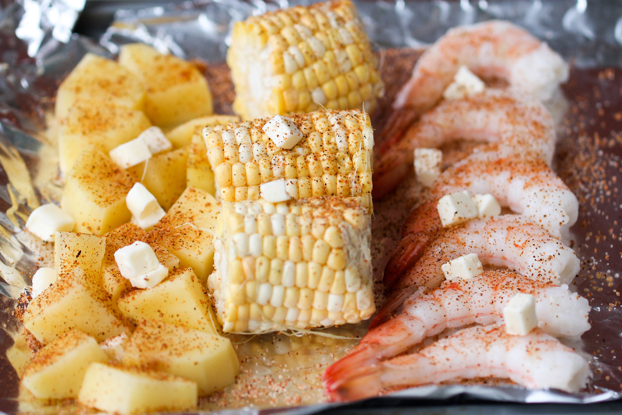 Oven baked Shrimp Boil is an easy dinner-friendly dish that can be enjoyed within less than an hour! Requires very little preparation, few ingredients, and pretty much no clean up.