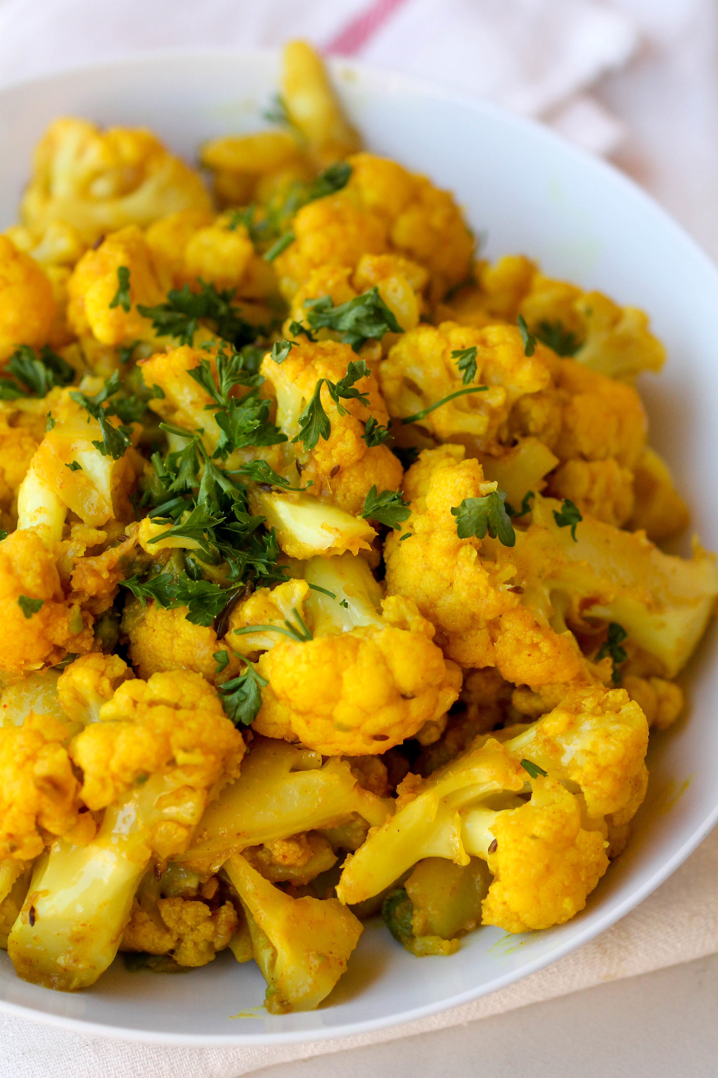 Cauli Aloo is a one pot vegetarian/vegan/gluten-free side dish that can be made under 30 minutes.