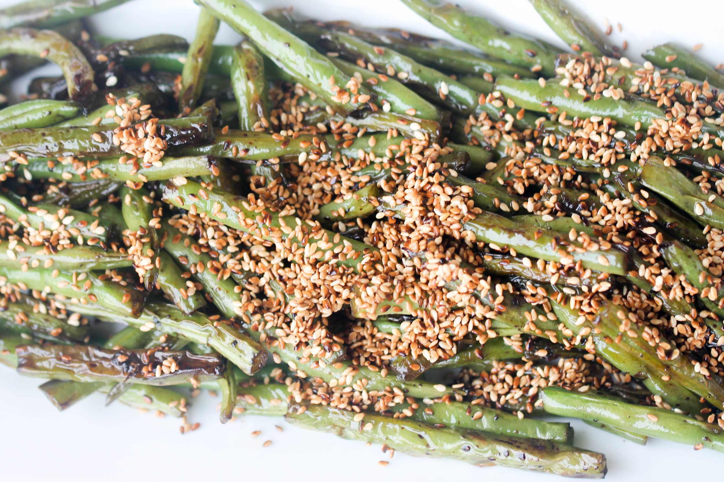 Green Beans with Sesame are perfect as a side for a quick weeknight dinner or for parties. Takes only 15 minutes and less than 5 ingredients to make. Naturally vegan & can be made gluten-free!
