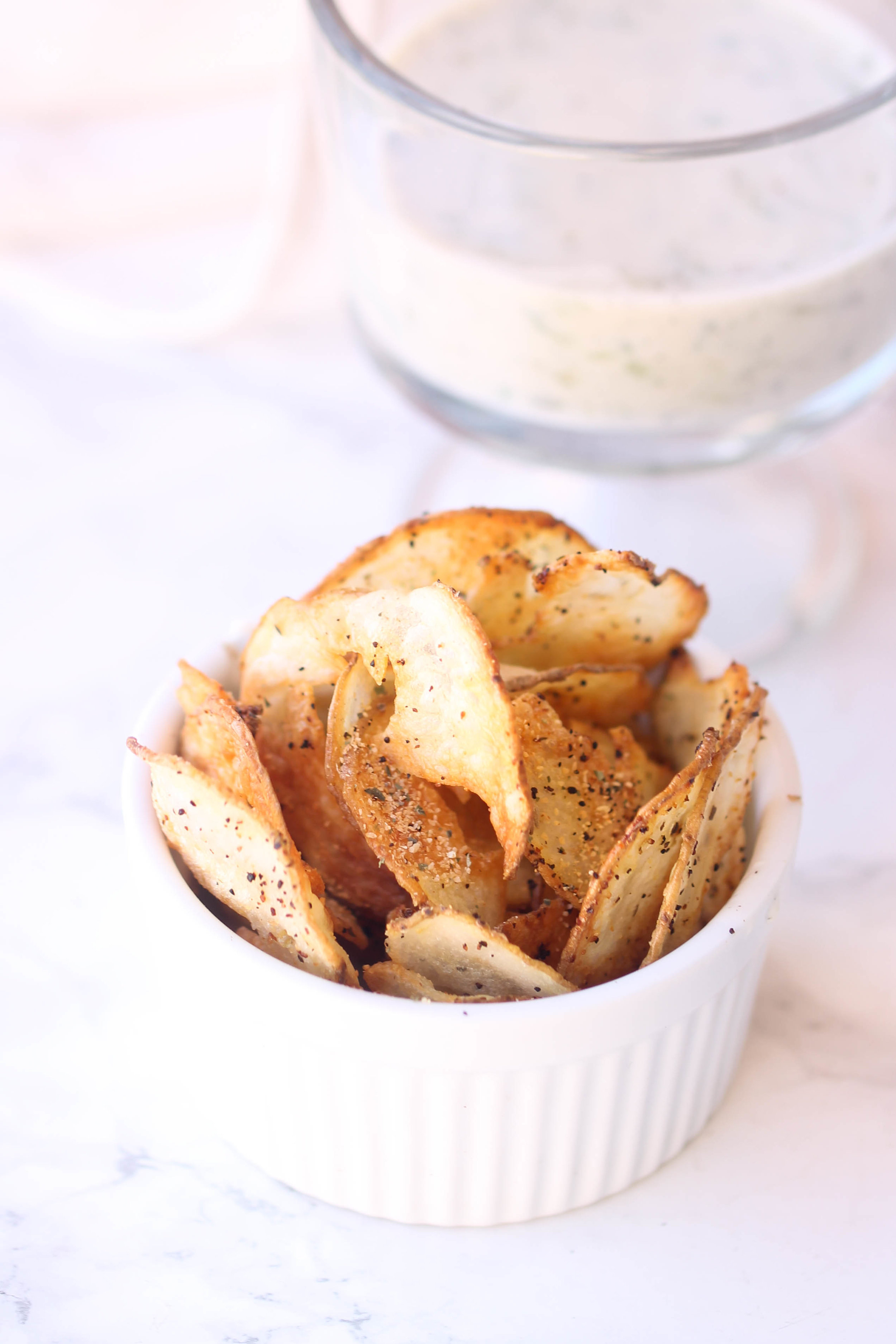 Crispy Baked Potato Chips are a healthier alternative to store-bought potato chips. They are super simple to make and you can easily customize herbs and spices.